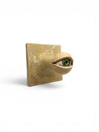 Artisan ceramic wall hook in the shape of a green eye with Kannyu crackle glaze background, handcrafted from Belgian Sibelco stoneware.