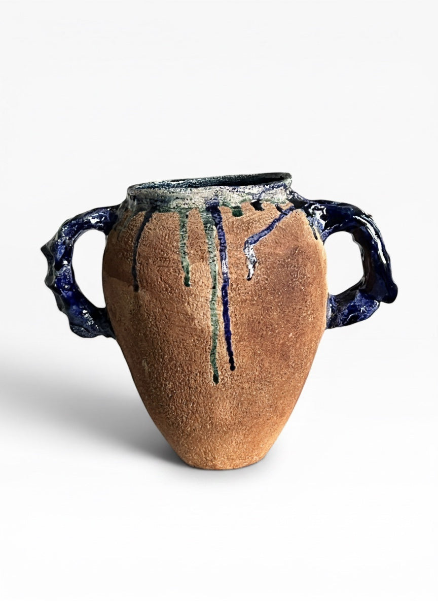 OK.CERAMICS handmade terracotta amphora vase with textured handles and blue and green glossy glaze drips.