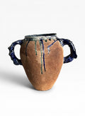 OK.CERAMICS handmade terracotta amphora vase with textured handles and blue and green glossy glaze drips.