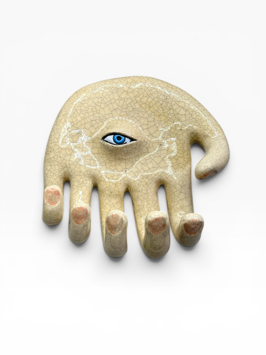 Front view of the handcrafted ceramic wall hook Eye Hand (20x20x7 cm) featuring five finger hooks, a central blue eye, and a Kanyū crackle glaze finish on a neutral background.